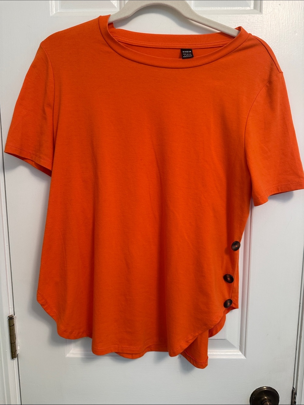 O
Orange Tee with Button Detail